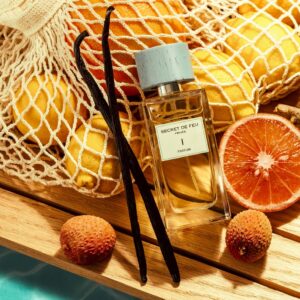 Secret de Feu I with citrus fruit and vanilla pods beside a pool
